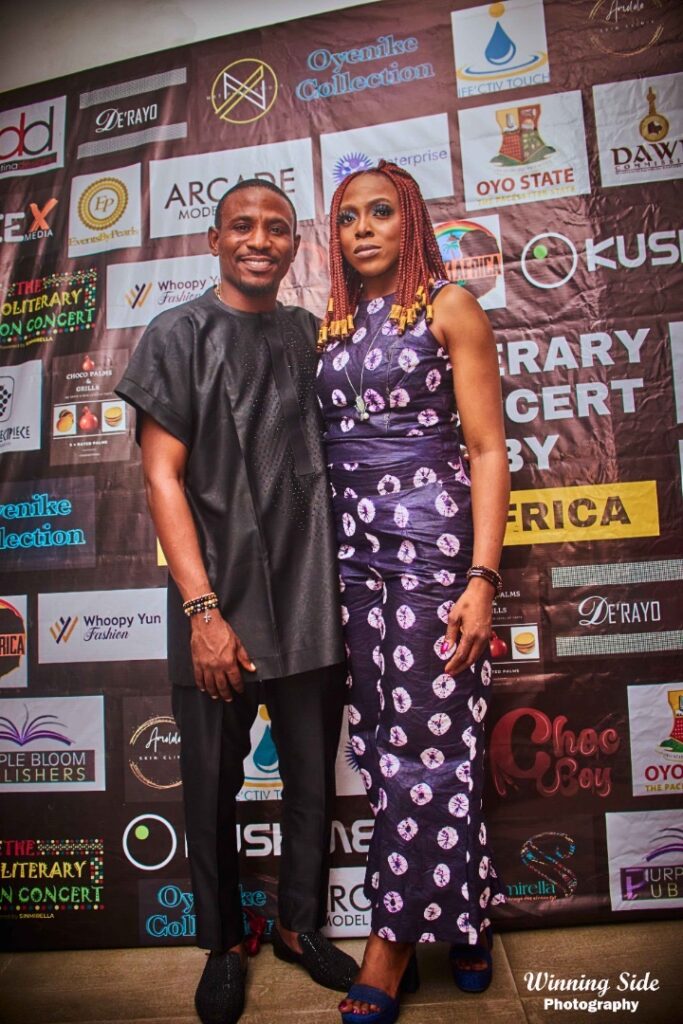 Guests on the red carpet at the AfroLiterary Fashion Concert 1.0 in front of the sponsors wall (Photo: Winning Side Photography)